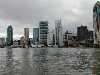 A photo of the Brisbane skyline from the Brisbane river, aboard the 'City Cat', a catamaran 'bus' that plies the waterways of Brisbane.