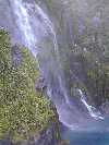 View of a large waterfall on Milford Sound taken from the cruise ship.
